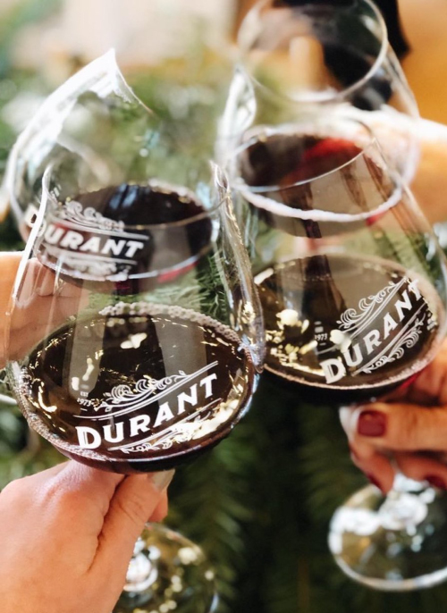 Durant Oregon Pinot Noir glasses held together for a cheers