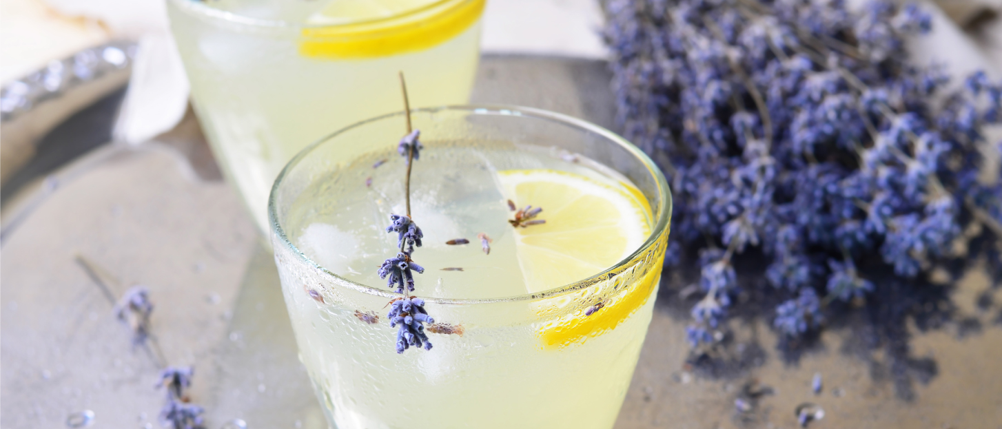 cold glass of lemonade with fresh lavender flowers