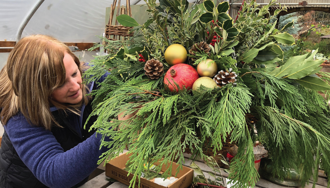 woman making a hanging basket for Christmas